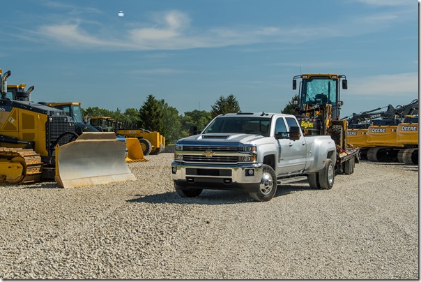 2018 Silverado 3500 HD Silver Ice Metallic LT Crew Cab towing John Deere Wheel Loader with a Big Tex Trailer. Towing 20,225 pounds (total weight of trailer and equipment combined).