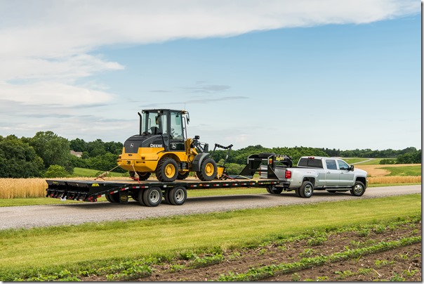2018 Silverado 3500 HD Silver Ice Metallic LT Crew Cab towing John Deere Wheel Loader with a Big Tex Trailer. Towing 20,225 pounds (total weight of trailer and equipment combined).